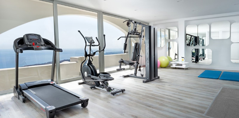<img=”santorini_zen_spa.png” alt=”Santorini Zen Spa guests may use of Dome Resort's Gym for free.”>