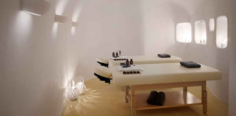 <img=”santorini_zen_spa.png” alt=”Santorini Zen Spa massage suite.”>